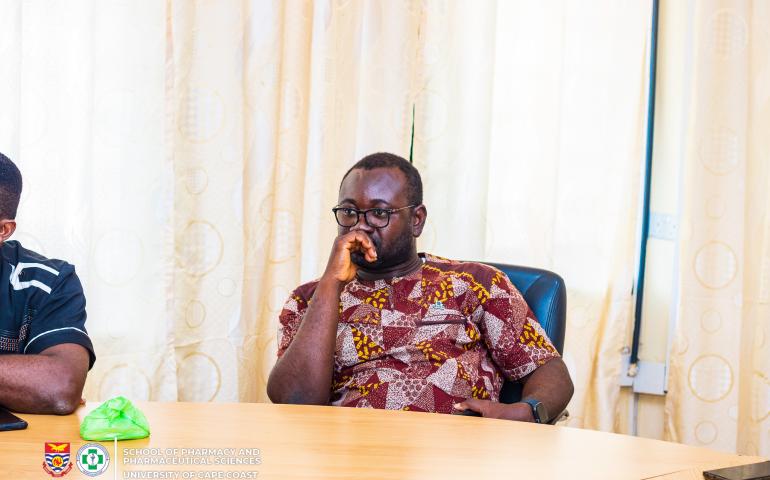 Dr Ernest Obese (Vice Dean) listening to Professor Jon Wietholter